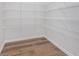 Walk-in closet features laminate flooring and metal shelving at 5314 Noble Crossing W Pkwy, Noblesville, IN 46062