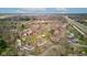 An aerial shot displaying a community, showing diverse homes and the surrounding lush greenery near highway access at 5902 Sunset Dr, Indianapolis, IN 46239