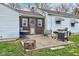 Cozy back patio featuring a grill, seating area, and charming wood accents at 5902 Sunset Dr, Indianapolis, IN 46239