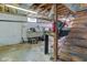 Unfinished basement with wood stairs at 5902 Sunset Dr, Indianapolis, IN 46239