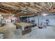 Unfinished basement with a pool table and work out equipment at 5902 Sunset Dr, Indianapolis, IN 46239