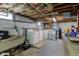 Unfinished basement with washer, dryer, and utility sink at 5902 Sunset Dr, Indianapolis, IN 46239