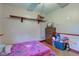 bedroom with hardwood floors, space for play, and neutral paint at 5902 Sunset Dr, Indianapolis, IN 46239