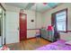 Comfortable bedroom with hardwood floors, with natural light and neutral paint at 5902 Sunset Dr, Indianapolis, IN 46239