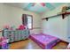 Bright bedroom with hardwood floors, natural light from a window, and neutral paint at 5902 Sunset Dr, Indianapolis, IN 46239