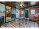 Unique dining room features hardwood floors, decorative doors, with an ornate ceiling fan and custom window trim at 5902 Sunset Dr, Indianapolis, IN 46239