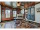 Dining room with a wood floor design, a fireplace, and windows that provide natural light at 5902 Sunset Dr, Indianapolis, IN 46239