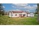 Quaint single-Gathering home featuring a covered porch, attached garage, and peaceful surroundings at 5902 Sunset Dr, Indianapolis, IN 46239