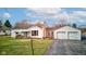 Charming single-Gathering home with a well-manicured lawn and attached two-car garage at 5902 Sunset Dr, Indianapolis, IN 46239