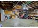 Spacious garage with exposed wood beams, ample storage, and plenty of room for projects at 5902 Sunset Dr, Indianapolis, IN 46239