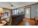 Cozy living room with a wood-burning fireplace, comfortable seating, and warm wood floors at 5902 Sunset Dr, Indianapolis, IN 46239