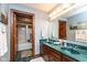 Stylish bathroom with a double vanity and a separate shower stall in the background at 6010 Fawnwood Dr, Greenwood, IN 46143