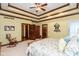 Comfortable bedroom featuring a trey ceiling and a cozy rocking chair in the corner at 6010 Fawnwood Dr, Greenwood, IN 46143