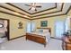Serene bedroom with trey ceiling, ceiling fan, and relaxing decor at 6010 Fawnwood Dr, Greenwood, IN 46143
