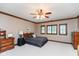 Comfortable bedroom with neutral colors, wood trim, and ample natural light at 6010 Fawnwood Dr, Greenwood, IN 46143