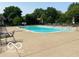A community pool is surrounded by lounge chairs and umbrellas at 6010 Fawnwood Dr, Greenwood, IN 46143