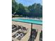 A community pool is surrounded by lounge chairs and a fence at 6010 Fawnwood Dr, Greenwood, IN 46143