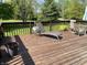 Relaxing deck area featuring outdoor furniture, potted plants, and a scenic backyard view at 6010 Fawnwood Dr, Greenwood, IN 46143