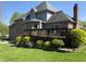 Inviting deck with an outdoor seating area surrounded by landscaped shrubs providing an ideal space for entertaining at 6010 Fawnwood Dr, Greenwood, IN 46143