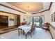 Elegant dining room featuring a chandelier, wood trim, and bay window at 6010 Fawnwood Dr, Greenwood, IN 46143