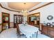 Charming dining room showcasing detailed wood trim, chandelier, and a classic china cabinet at 6010 Fawnwood Dr, Greenwood, IN 46143