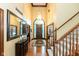 Grand foyer with high ceilings, hardwood floors, and a staircase with carpet runner at 6010 Fawnwood Dr, Greenwood, IN 46143