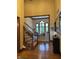 Welcoming foyer featuring hardwood floors, a staircase, and views into other living spaces at 6010 Fawnwood Dr, Greenwood, IN 46143