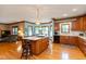 Spacious kitchen featuring an island with barstool seating and hardwood floors at 6010 Fawnwood Dr, Greenwood, IN 46143