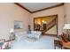 Spacious living room with an open floor plan, piano, and comfortable seating at 6010 Fawnwood Dr, Greenwood, IN 46143