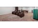 Basement space featuring a home theater with reclining chairs and a vintage candy machine at 6615 School Branch Dr, Brownsburg, IN 46112