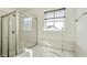 Bright bathroom featuring a shower, a large soaking tub, and a window at 6615 School Branch Dr, Brownsburg, IN 46112