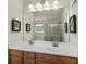 Elegant bathroom with double sinks, a large mirror, modern lighting, and decor at 6615 School Branch Dr, Brownsburg, IN 46112