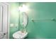 Clean half bathroom featuring a toilet, light fixture, wall-mounted towel bar, and sink at 6615 School Branch Dr, Brownsburg, IN 46112