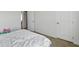 Simple bedroom with a made bed, good lighting, and an open floor plan at 6615 School Branch Dr, Brownsburg, IN 46112