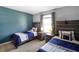Charming bedroom featuring two twin beds with rustic wooden headboards and coordinated bedding at 6615 School Branch Dr, Brownsburg, IN 46112