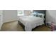 Bright bedroom with a comfortable bed, soft pillows, and natural light from the window at 6615 School Branch Dr, Brownsburg, IN 46112