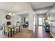 Dining room with large glass top table and neutral color chairs, and lots of natural light at 6615 School Branch Dr, Brownsburg, IN 46112