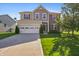 Lovely home with a beautiful lawn, two car garage and a nice tree in the front yard at 6615 School Branch Dr, Brownsburg, IN 46112