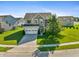 Charming two-story home with a manicured lawn, two car garage and a well-maintained landscape at 6615 School Branch Dr, Brownsburg, IN 46112