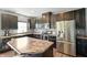Modern kitchen with stainless steel appliances, dark wood cabinets, and stylish countertops at 6615 School Branch Dr, Brownsburg, IN 46112