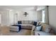 Inviting living room featuring a comfortable sectional sofa and a wall-mounted entertainment unit at 6615 School Branch Dr, Brownsburg, IN 46112