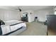 Inviting main bedroom featuring an entertainment center with a television, carpet flooring, and a ceiling fan at 6615 School Branch Dr, Brownsburg, IN 46112