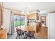 Bright dining area featuring wood table, sliding door access to the outside, and modern finishes at 6905 E Hanna Ave, Indianapolis, IN 46203
