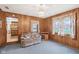 Bright living room with wood accents, cozy seating, and an inviting atmosphere for relaxation at 6905 E Hanna Ave, Indianapolis, IN 46203