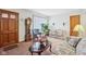 Inviting living room featuring a decorative fireplace, plush seating, and ample natural light at 6905 E Hanna Ave, Indianapolis, IN 46203