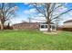 A beautiful brick house featuring a well-maintained lawn and large trees in the backyard at 6958 W Brier Creek Dr, New Palestine, IN 46163