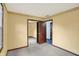 A neutral toned bedroom featuring an adjoining room with a connecting door at 6958 W Brier Creek Dr, New Palestine, IN 46163