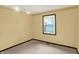 Bedroom with patterned wallpaper border, and a view of the yard through the window at 6958 W Brier Creek Dr, New Palestine, IN 46163