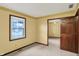 Bedroom showcasing natural light through the window and a closet with mirrored sliding doors at 6958 W Brier Creek Dr, New Palestine, IN 46163