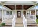 Inviting covered front porch with decorative white railings and access to front door at 6958 W Brier Creek Dr, New Palestine, IN 46163